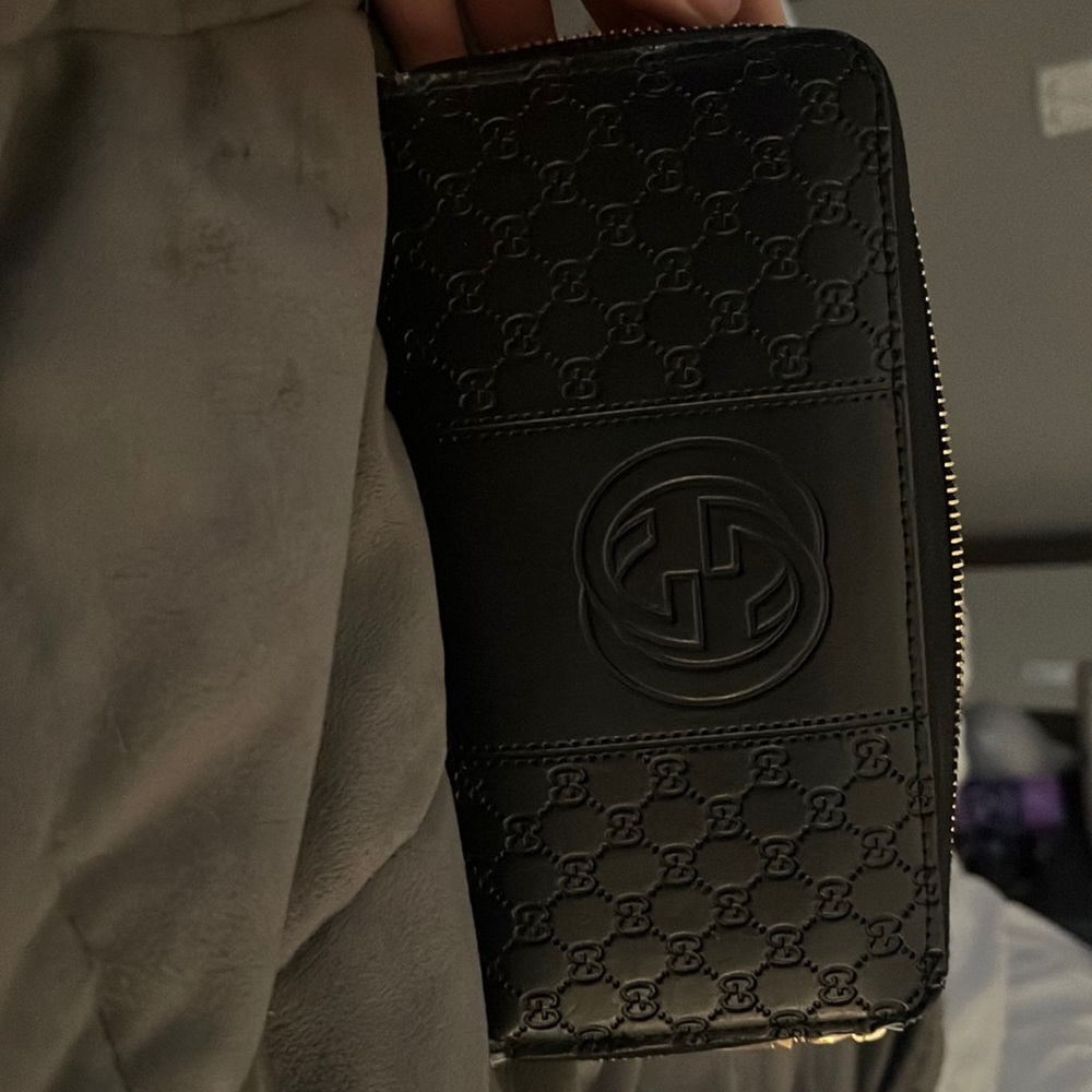 Gucci wallet some tears on the side from normal wear and tear
